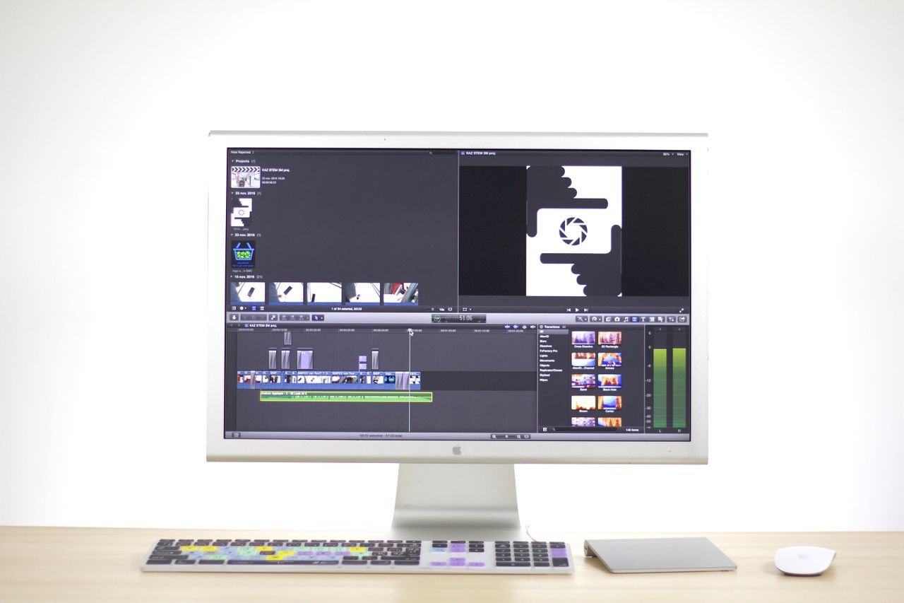 services-01 A sleek computer monitor displays video editing software in a modern workspace.